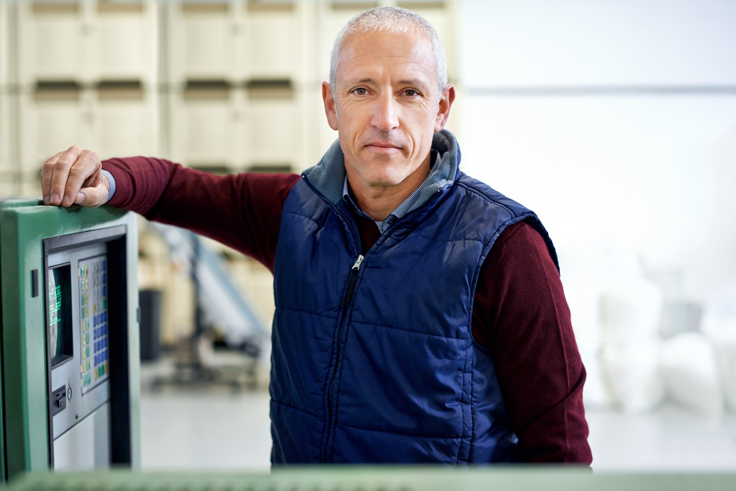 Tax time with wooden alphabet blocks, red alarm clock, calculator and pen on 1040 tax form background