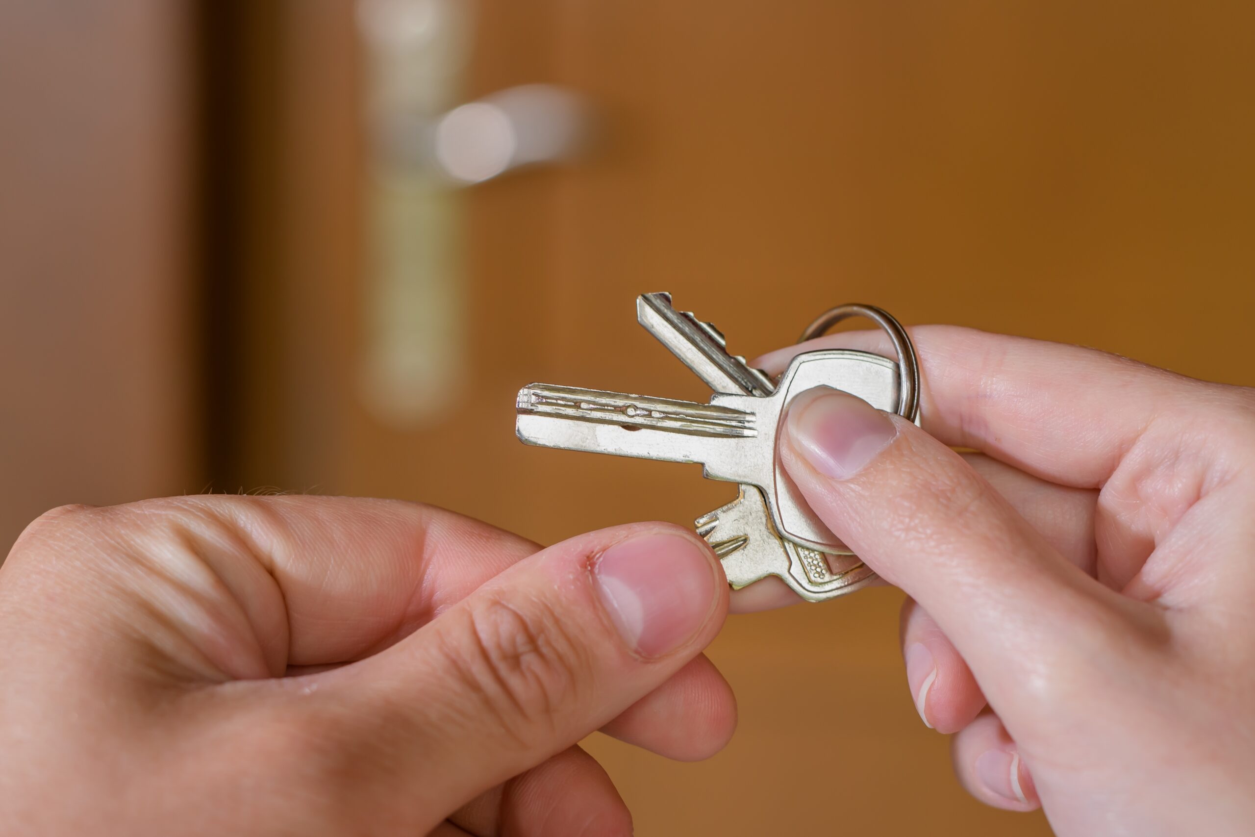Tax time with wooden alphabet blocks, red alarm clock, calculator and pen on 1040 tax form background